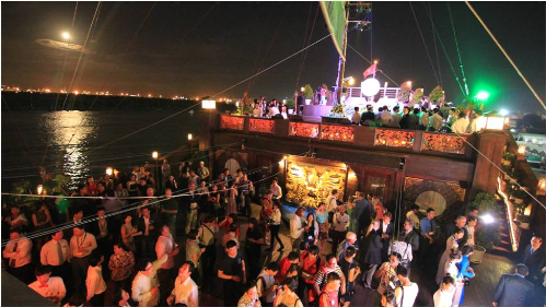 Guests present at the rooftop of Elisa ship to track the Lightboat festival