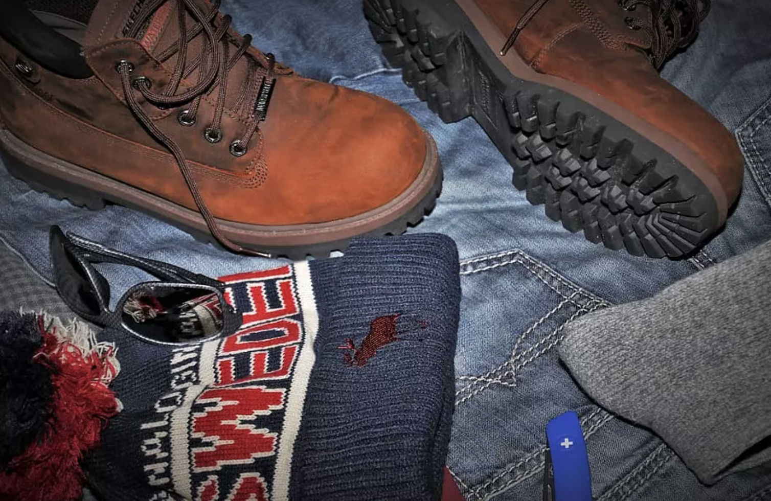 Hiking boots and clothing are two heavy items that take up a lot of suitcase space.
