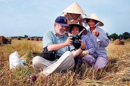 Foreign tourists with Vietnamese in the field